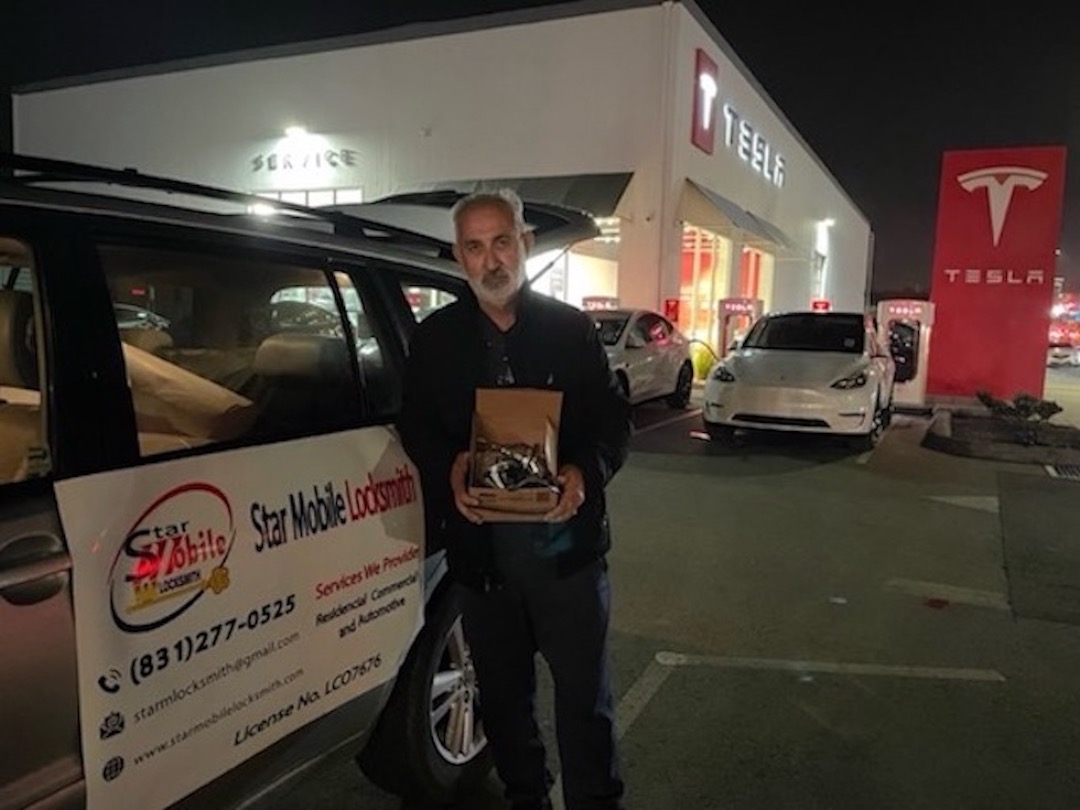 Star Mobile Locksmith technician outside Tesla dealership after providing emergency car locksmith service in Monterey County